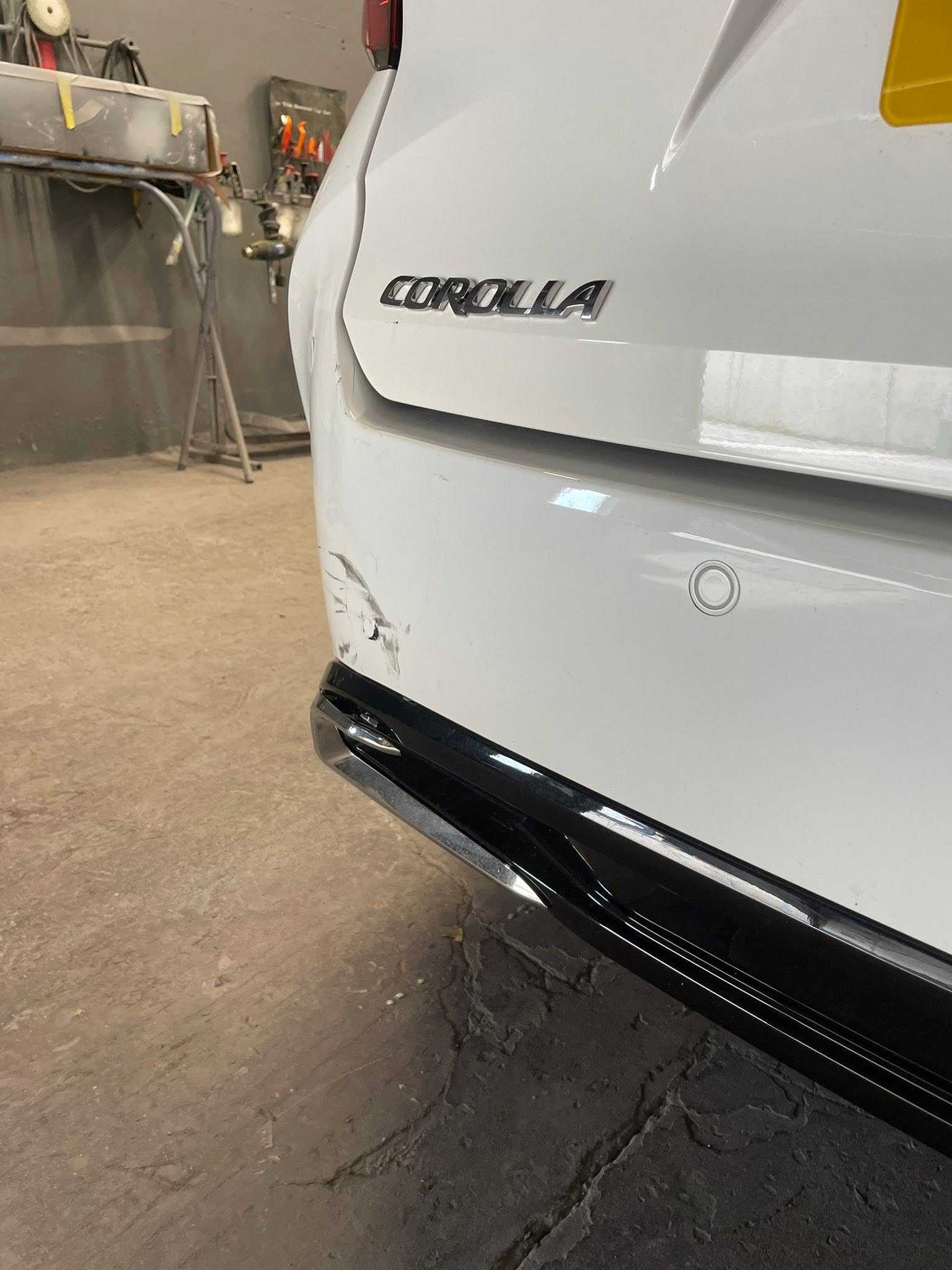 White Toyota Corolla in the garage workshop