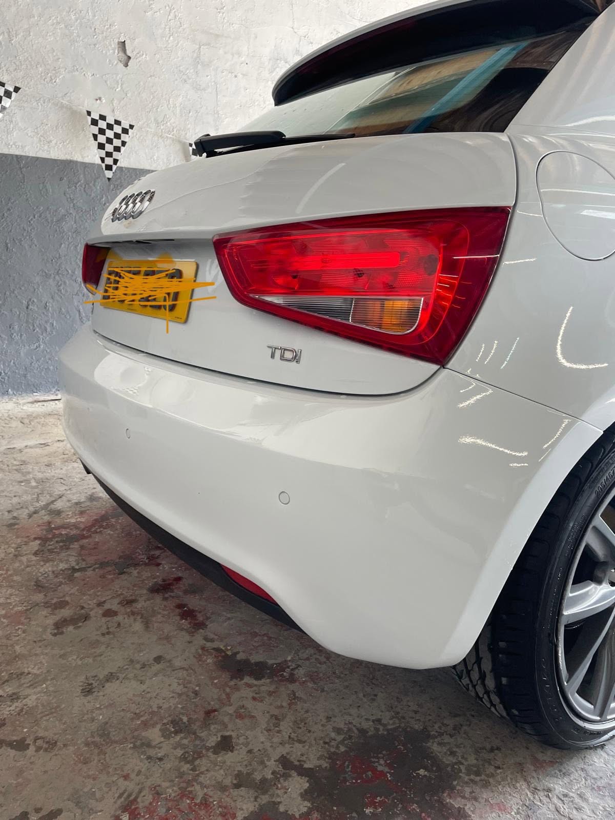 White Audi saloon rear end with custom work
