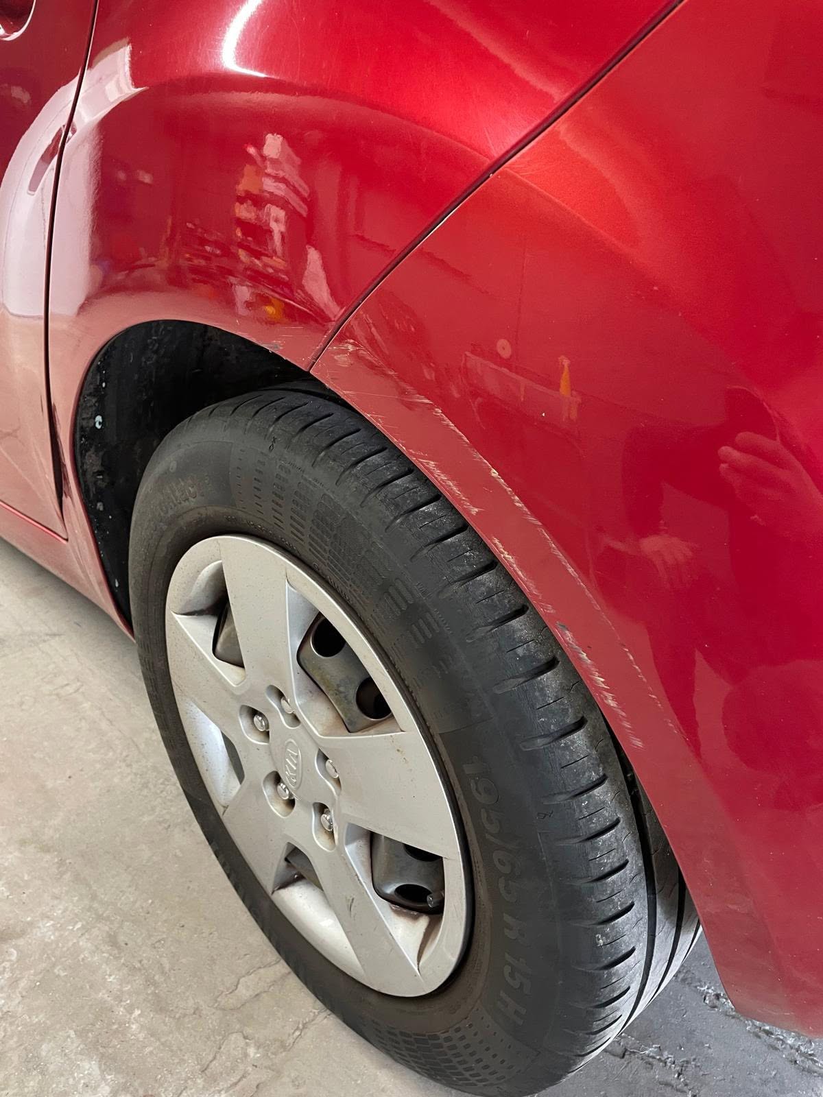 Red vehicle with white wheel and black tyre