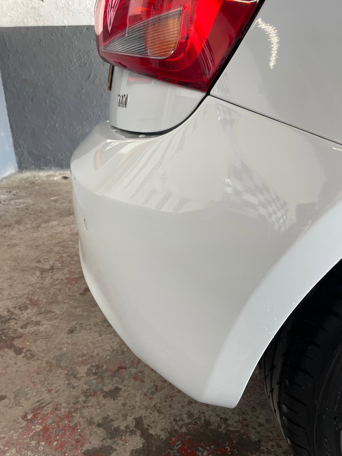 White vehicle rear bumper and taillight detail
