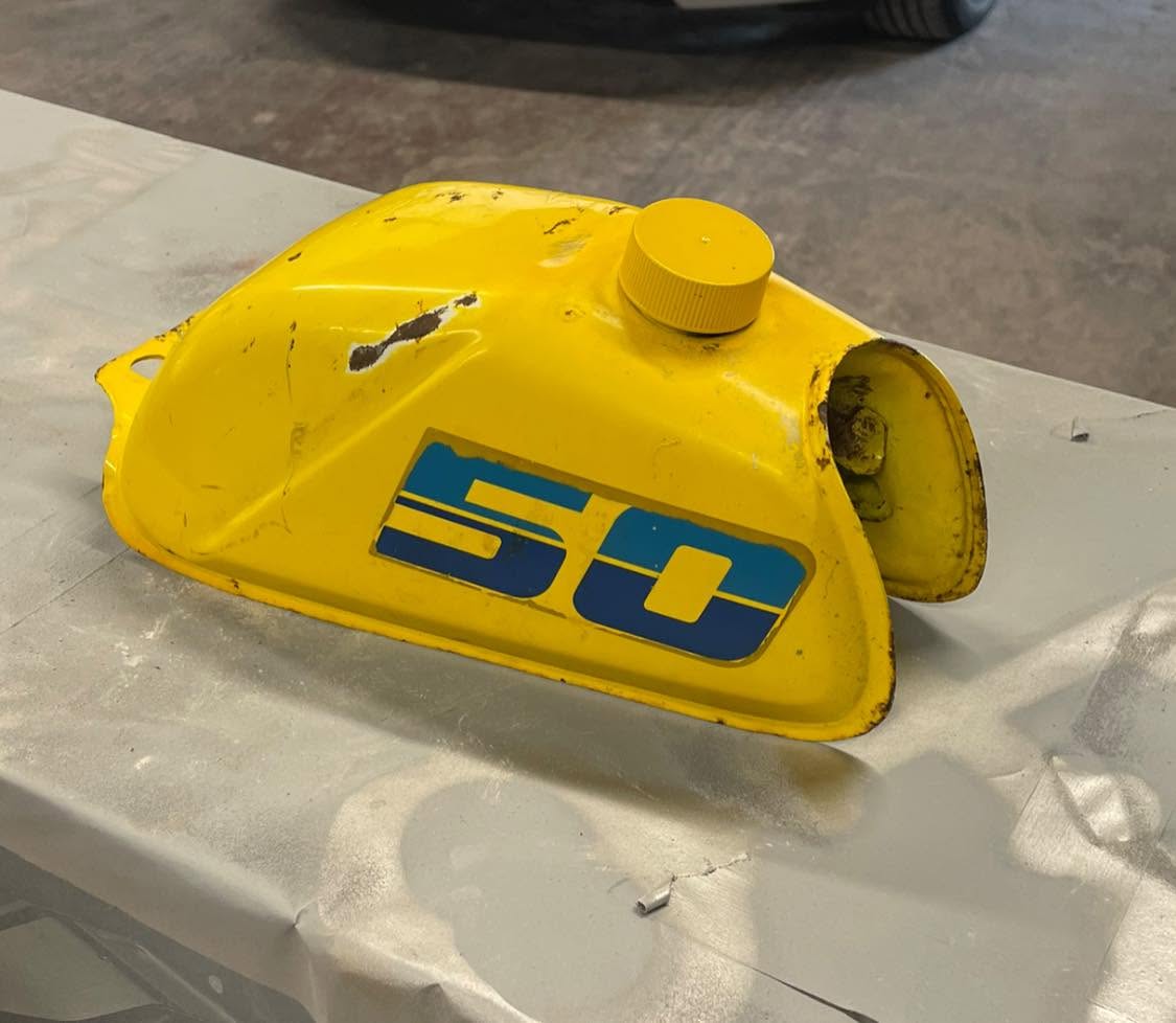 Yellow fuel tank container with branded logo